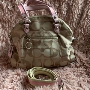 Coach handbag with detachable crossbody strap.